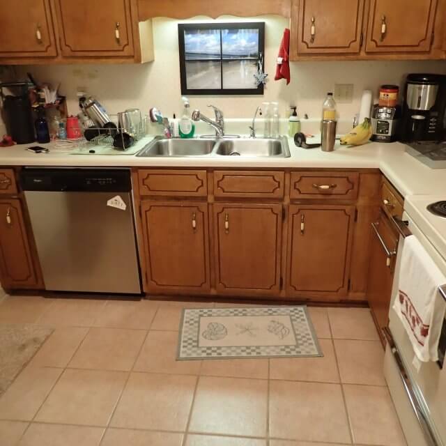 Old kitchen with cluttered countertop