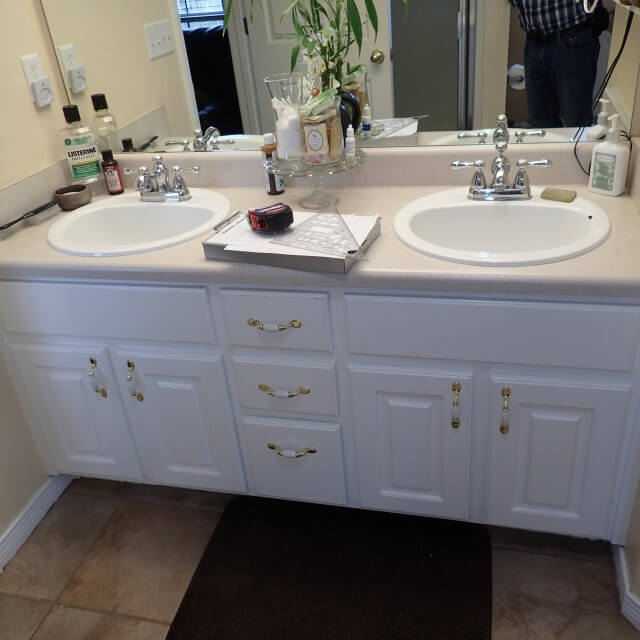 Before: Outdated bathroom counter and sinks