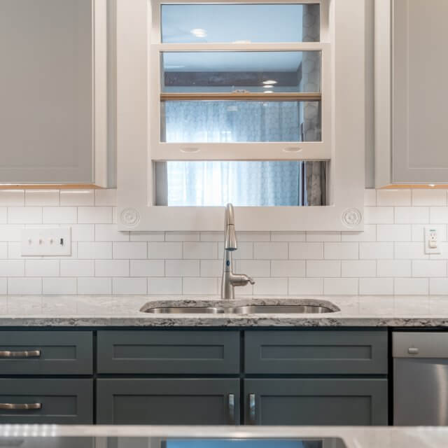 After: A view of traditional white subway tile backsplash used for the kitchen.