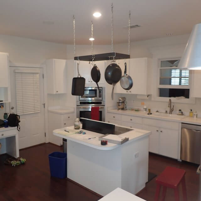 Before: The kitchen featured white cabinets from the ceiling to the floor before Cabinet Depot did renovations.