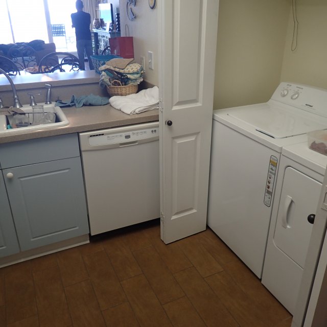 Laundry area before condo kitchen remodel